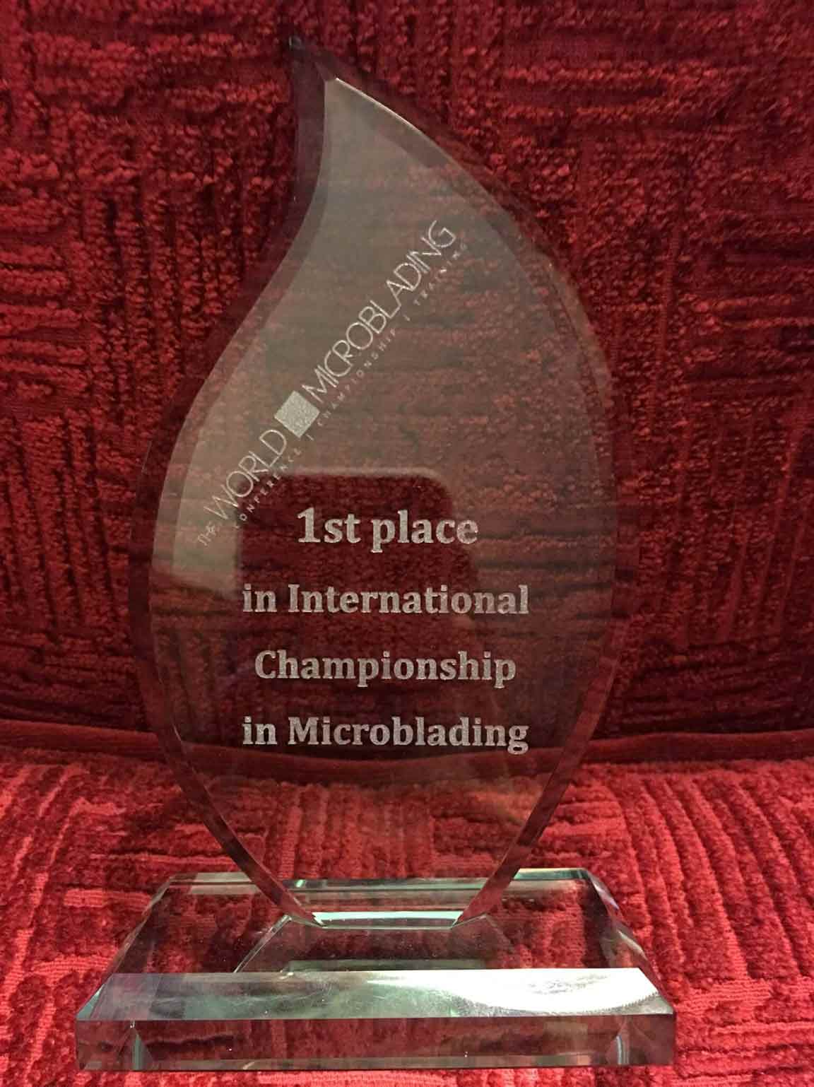 The World of Microblading Champion trophy, awarded to 1st Place Winner Lindsey Ta